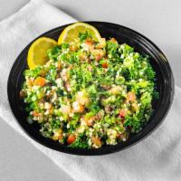 Tabouli · Famous Middle Eastern salad made of finely chopped parsley, tomatoes, mint, bulgur, and gree...