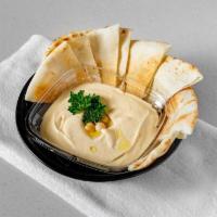 Hummus W/ Pita Bread · A famous creamy dip made from scratch using chickpeas, extra virgin olive oil, lemon juice, ...