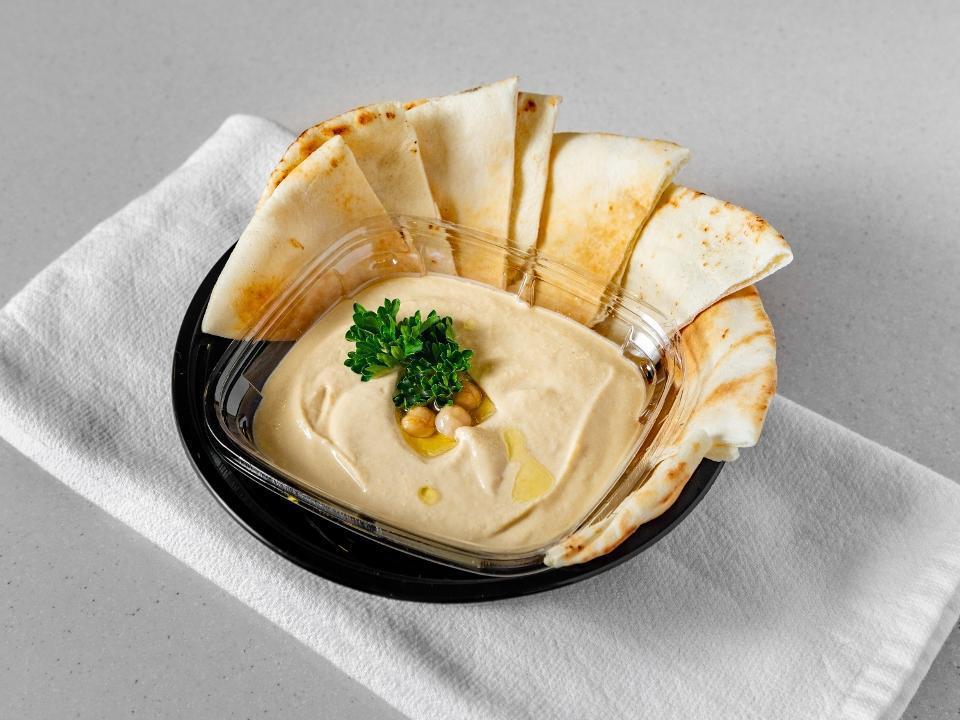 Hummus W/ Pita Bread · A famous creamy dip made from scratch using chickpeas, extra virgin olive oil, lemon juice, garlic, tahini. Served with our special thin pita bread.