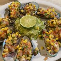 Almejas Preparada · A dozen marinated mussels with fresh lime juice, onions, tomatoes and corn dressed with a ki...