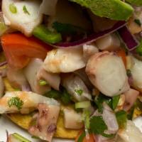 Shrimp Tostadas · Boiled shrimp topped with fresh onions, tomatoes, cilantro, celery, fresh jalapeños and avoc...