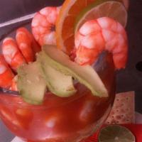 Shrimp Cocktail · Shrimp drowned in our house cocktail sauce with onions, cilantro, avocado slices, and cucumb...