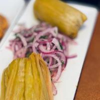 Green Tamal · Synonymous with latin culture. Peruvian corn ground and seasoned with cilantro, stuffed with...