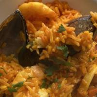 Inka Paella · A popular Spanish dish but made with a Peruvian flavor. Shrimp, calamari and mussels sautéed...