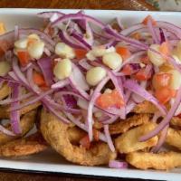 Fried Seafood And Fish (Jalea) · Great to share! Crispy pieces of fish, shrimp with mussel’s and calamari, with an unmatched ...