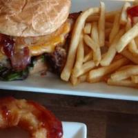 Roadhouse Burger · Half lb. patty stacked with onion rings, bacon, shredded cheddar, lettuce, tomato, pickles a...