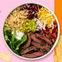Carne Asada Castaway Bowl · Grilled steak topped with sour cream, salsa, jalapeno, lettuce, sweet corn, onions, and chee...
