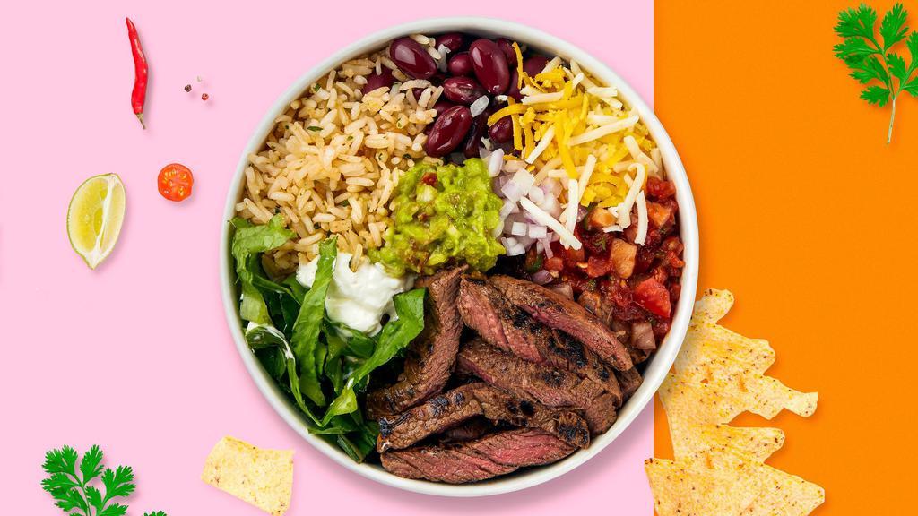 Carne Asada Castaway Bowl · Grilled steak topped with sour cream, salsa, jalapeno, lettuce, sweet corn, onions, and cheese.