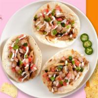 Taco Teasers · Your choice of protein topped with sour cream, salsa, and cilantro in a warm tortilla
