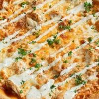 Chicken Wing Pizza · Topped with chicken, buffalo sauce, and ranch