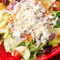Greek Salad · Lettuce, tomato, Kalamata, carrot, cucumber, beet, red onion, and feta.