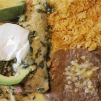 Seafood Enchiladas · Two flour tortillas rolled and stuffed with shrimp, crab and pico de gallo. Smothered in our...