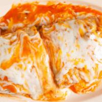 Burrito Suizo · Burrito filled with rice, beans, cheese choice of meat and our special Salsa Suiza topped wi...