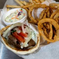 Classic Gyro Sandwich · Tender juicy carvings of gyro meat on a toasted pita smothered with tzatziki sauce topped wi...