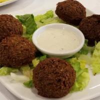 Falafel (6 Pcs) · Fresh grounded chickpeas, onions, parsley, cilantro garlic, salt, herbs and spices (served w...