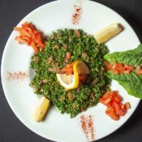 Tabouli · Finely chopped parsley, green onion, diced tomatoes and cucumber, combined with cracked whea...