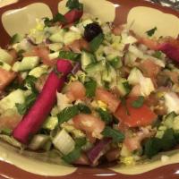 Lebanese Salad · Crisp romaine lettuce, diced tomatoes, cucumber, fresh mint, lemon juice, garlic salt.