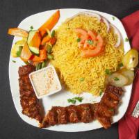 Kafta Kebab Platter · Ground lamb and beef mixture seasoned with our special spice blend, formed onto a skewer and...