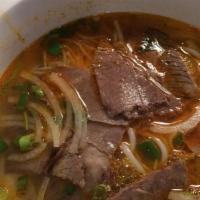 “Hue” Spicy Beef Noodle Soup (Bun Bo Heu) · Round rice noodles in a spicy lemon grass chicken broth.