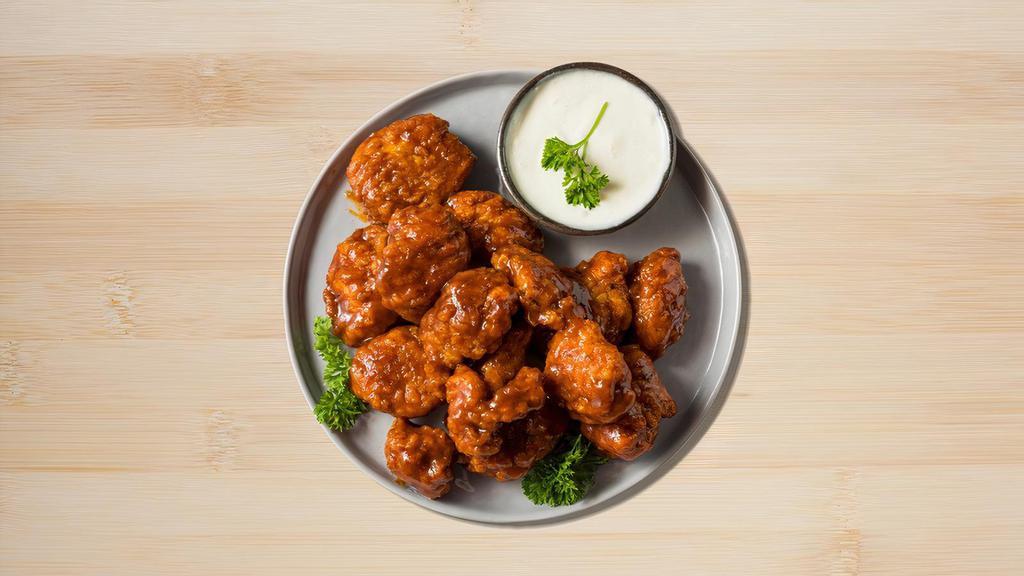 Boneless Buffalo Wings · Boneless chicken wings with choice of your favorite wing style. Served with blue cheese or ranch dressing.