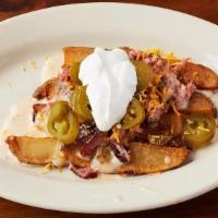 Loaded Potato Wedges · Fresh cut whole potato, deep fried and topped with queso, shredded cheddar cheese, jalapenos...