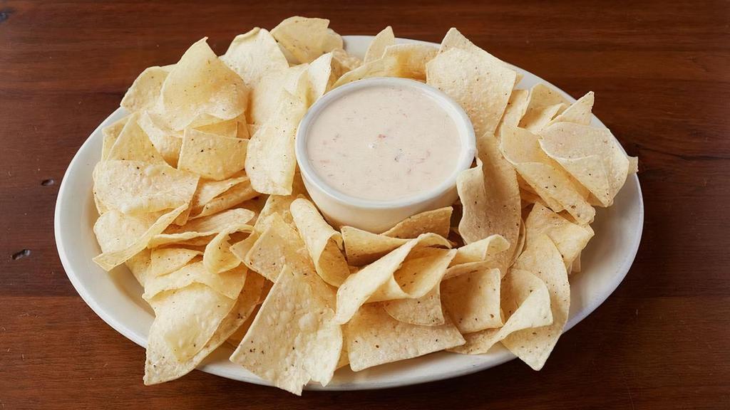 Queso And Chips · Creamy white cheese queso, with a BBQ twist & kick. Served with freshly fried white corn tortilla chips. Add brisket, pork or chicken for $1.50. Add rib meat for $2.