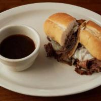 French Dip · Smoked prime rib sliced thin with swiss cheese. Served with au jus.
