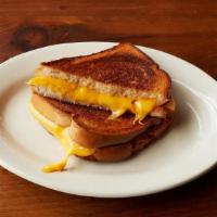 Grilled Cheese · Grilled Texas toast with 3 slices of creamy velveeta cheese.
