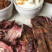 2 Meat Combo · Your choice of two: ribs, pulled pork, brisket, hot link or chicken.