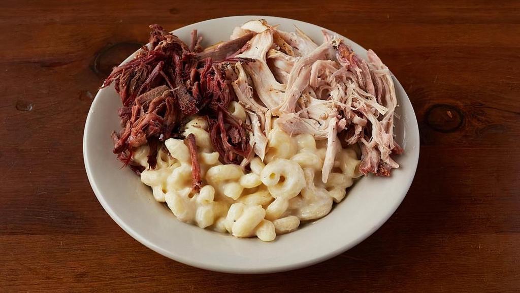 Mac & Cheese · Our delicious white cheddar mac & cheese topped with your choice of brisket, pulled pork, or hot link. Pick 2 for an additional $3.
