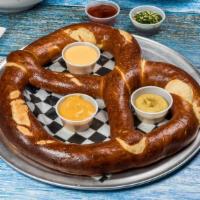 Giant Pretzel · Served with our Three homemade sauces. Serves Two or more.