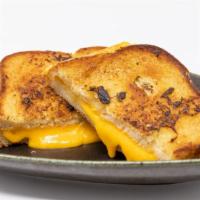 Grilled Cheese · garlic grilled toast, American cheese.