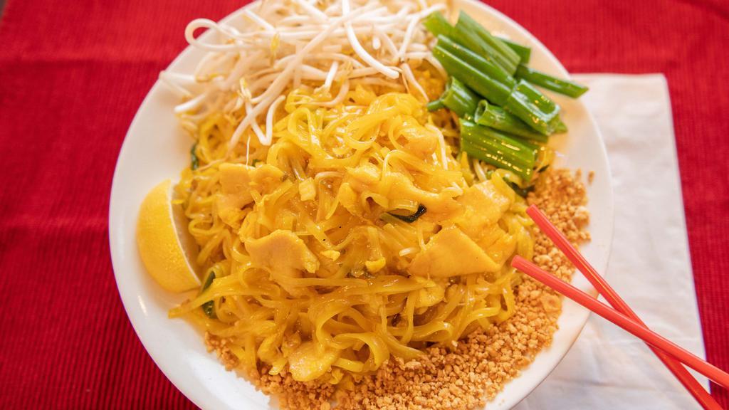 Pad Thai · Traditional rice noodles sauteed with eggs, green onions, bean sprouts and topped with peanuts.
