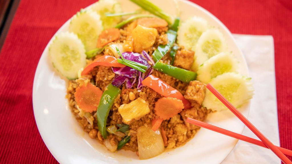 Curry Fried Rice (Mild) · Fried rice with egg, bell peppers, carrots, green onion, onion, pineapple and roasted peanuts.