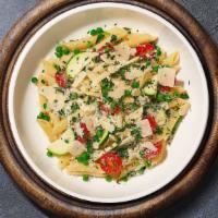 Primavera Pasta · Sauteed seasonal vegetables and tomatoes in a light tomato sauce in a bed of penne pasta. Se...