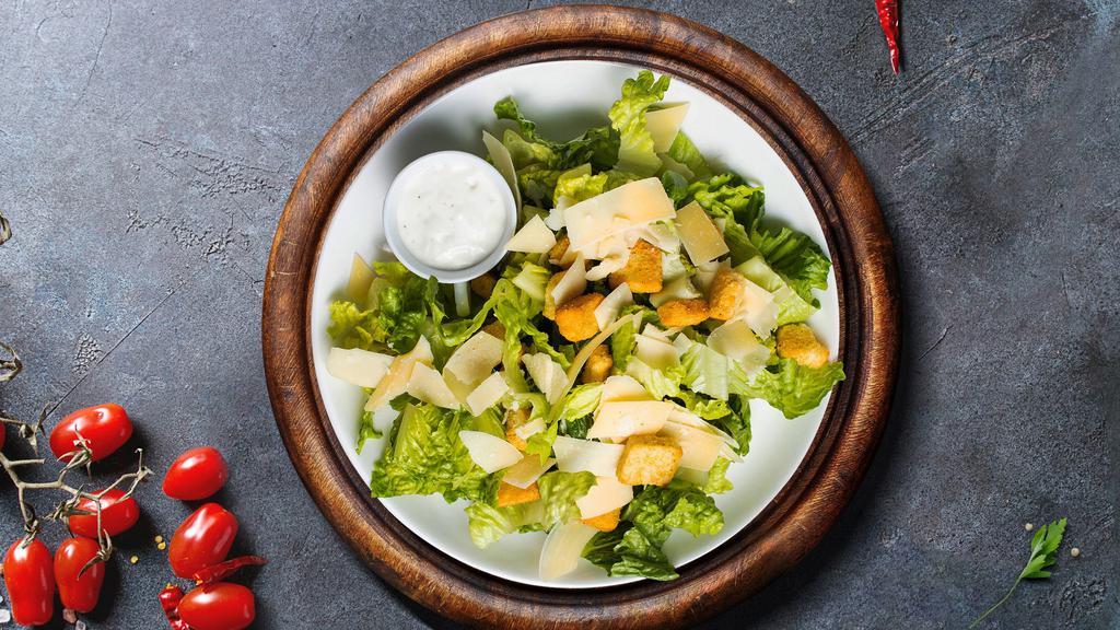 Caesar Salad · Crisp romaine lettuce, parmesan cheese and crunchy croutons. Served with caesar dressing on the side.