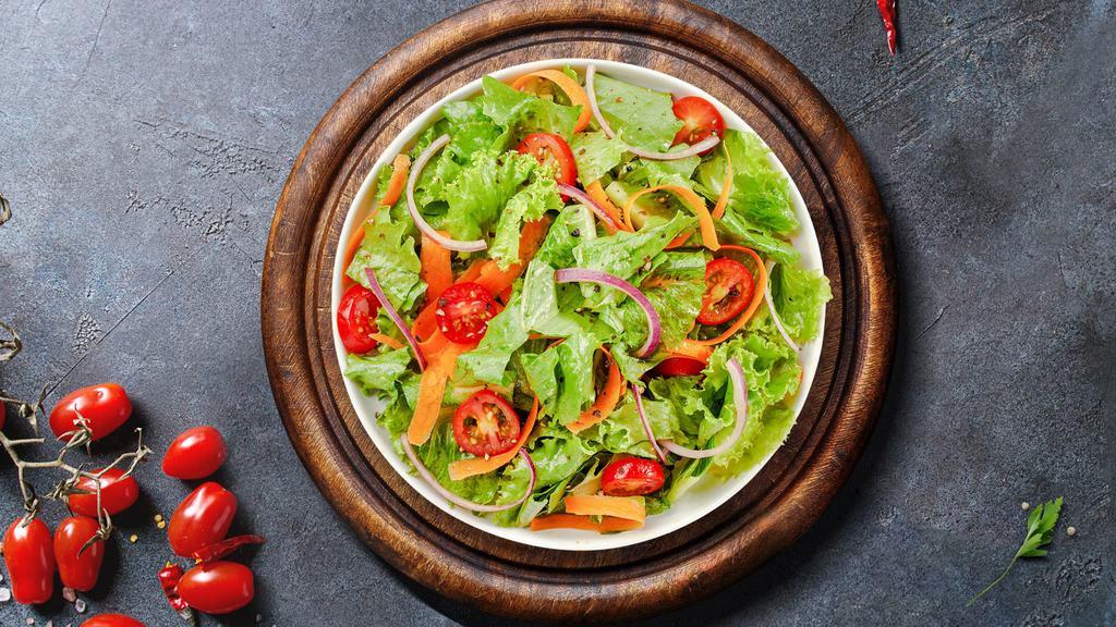 Garden Salad · Fresh green lettuce mix, tomatoes, black olives, red onions, bell peppers, and shredded mozzarella cheese. Served with choice of your dressing on the side.