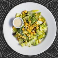 Classic Caesar Goodness · Crisp romaine lettuce, parmesan cheese and crunchy croutons. Served with caesar dressing on ...