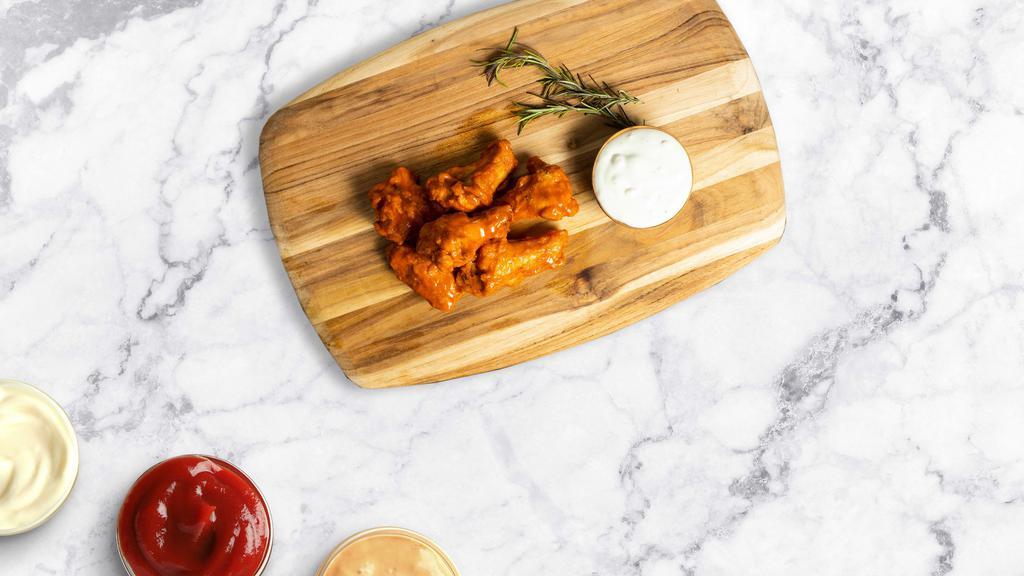 Fire Wings · Classic bone-in wings oven- baked, cooked to order perfectly crisp, and tossed with your choice of delicious sauces.