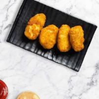 Gooey Jalapeño Poppers · Fried jalapeños filled with gooey melty cheese, served with ranch. 6 piece.