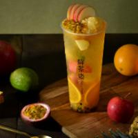 Signature Fruit Tea · white peach oolong tea with passion fruit puree, pineapple puree, and slices of apples/oranges