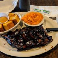 Ribs Half Slab · Served with choice of two sides