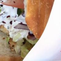 Döner Kebab · Served on homemade bread with tomato, Lettuce, cucumbers and doner sauce.