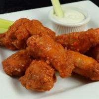 Chicken Wings · Choice of bbq sauce or spicy sauce. Served with carrots and celery sticks, with ranch dressi...
