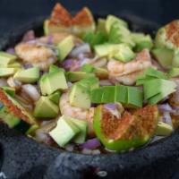 Camarones Aguachiles · Hot. Shrimp marinated in lime juice mixed with your choice of green or red salsa.