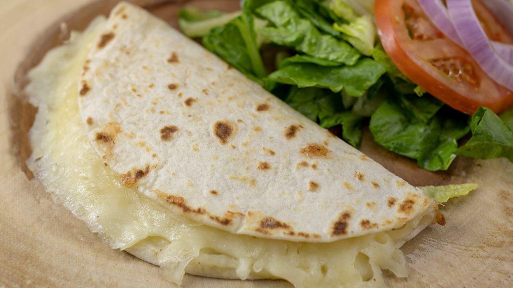 Quesadillas · Corn or flour tortilla filled with cheese and your choice of meat.