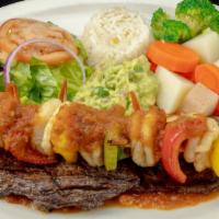 Mar Y Tierra · Charbroiled skirt steak topped with guacamole and grilled shrimp. Served with steamed vegeta...