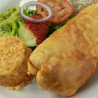 Chimichanga · Deep-fried burrito filled with your choice of meat and topped with guacamole and shredded ch...