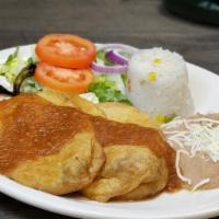 Chiles Rellenos · Two poblano peppers stuffed with Chihuahua cheese. Served with refried beans, white rice, so...