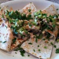 Quesadilla · Filled with chihuahua cheese, pico de Gallo, sour cream and guacamole.